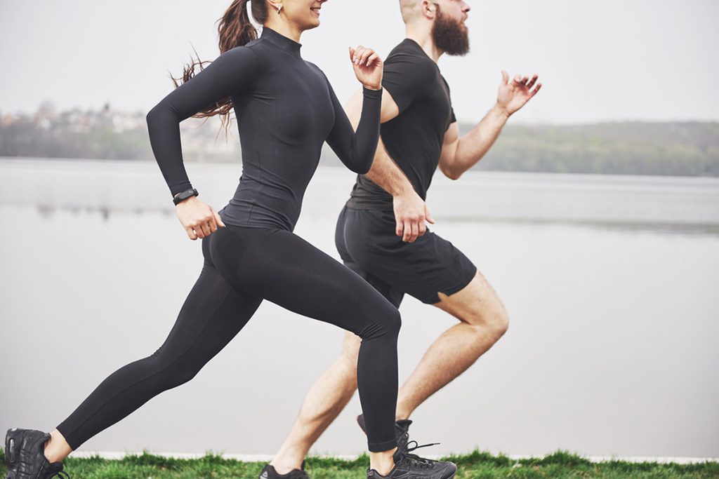 couple-jogging-running-outdoors-park-near-water-young-bearded-man-woman-exercising-together-morning